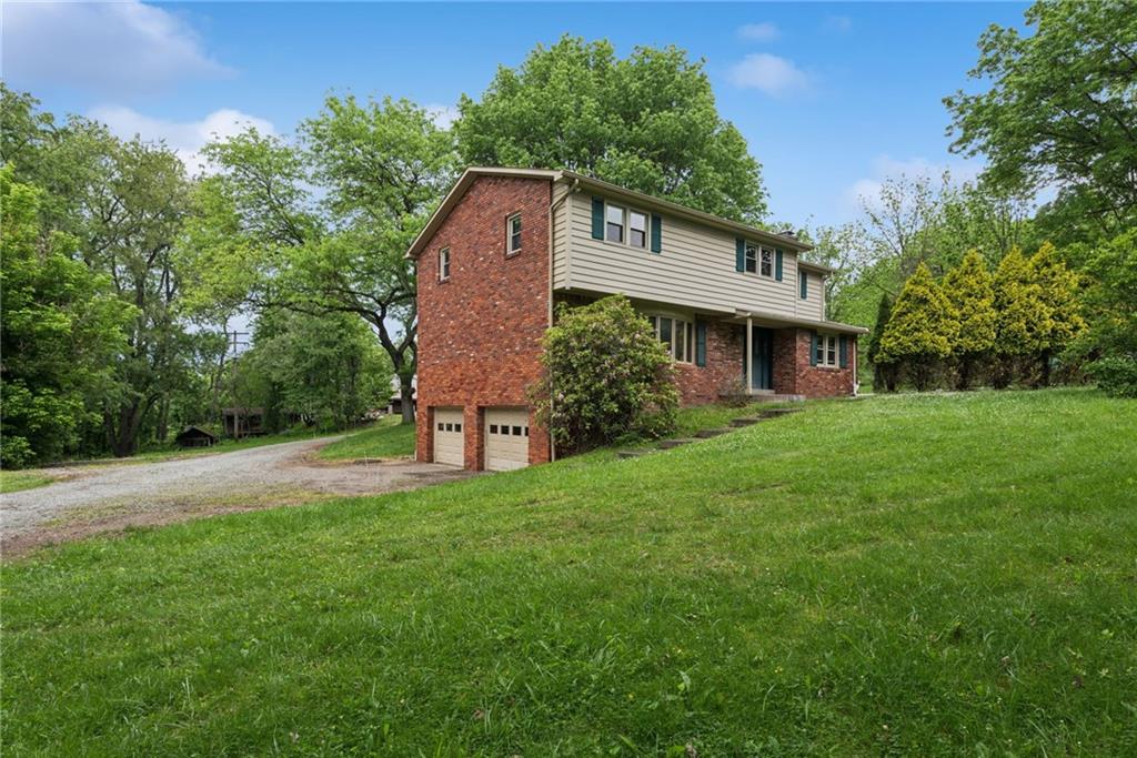 22 Buzzardtown Road Irwin, PA 15642 - Photo 31 of 44 a front view of a house with a yard and trees