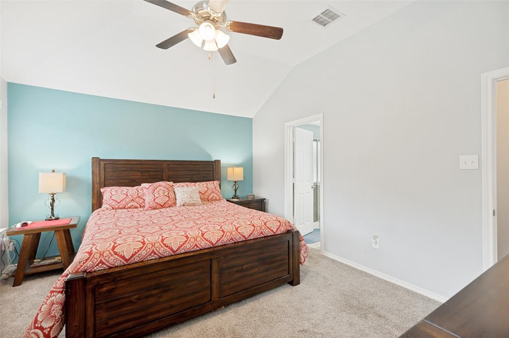 3905 Bridle Path Lane Sanger, TX 76266 - Photo 14 of 26 a bedroom with a bed and wooden floor
