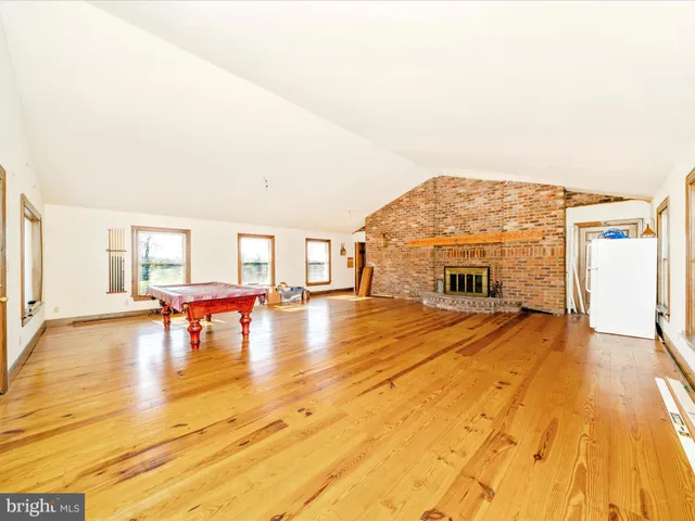 a kitchen with a sink a counter top space and a large window