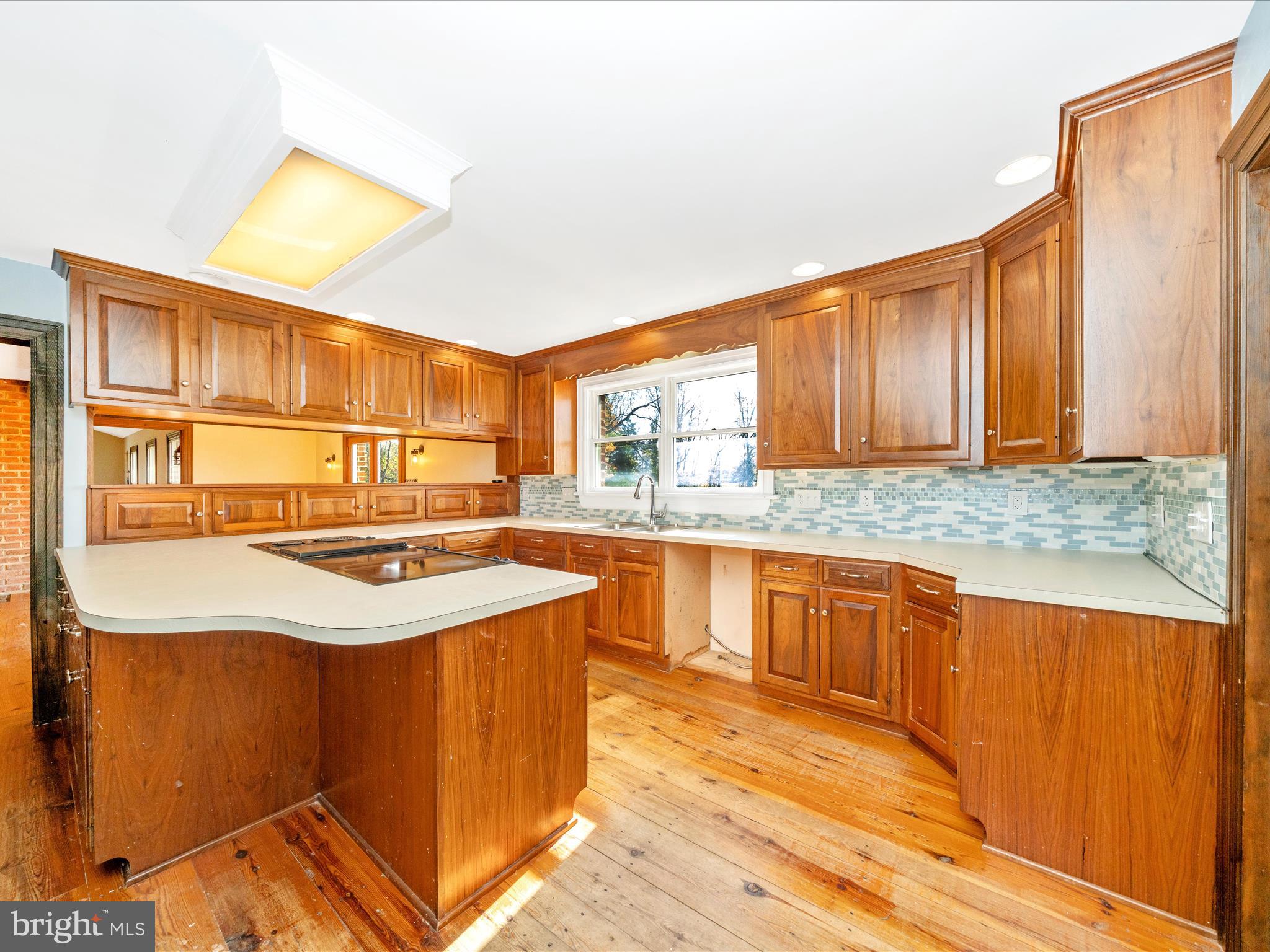 14924 Clear Spring Road Williamsport, MD 21795 - Photo 13 of 76 a kitchen with stainless steel appliances granite countertop a sink and a cabinets