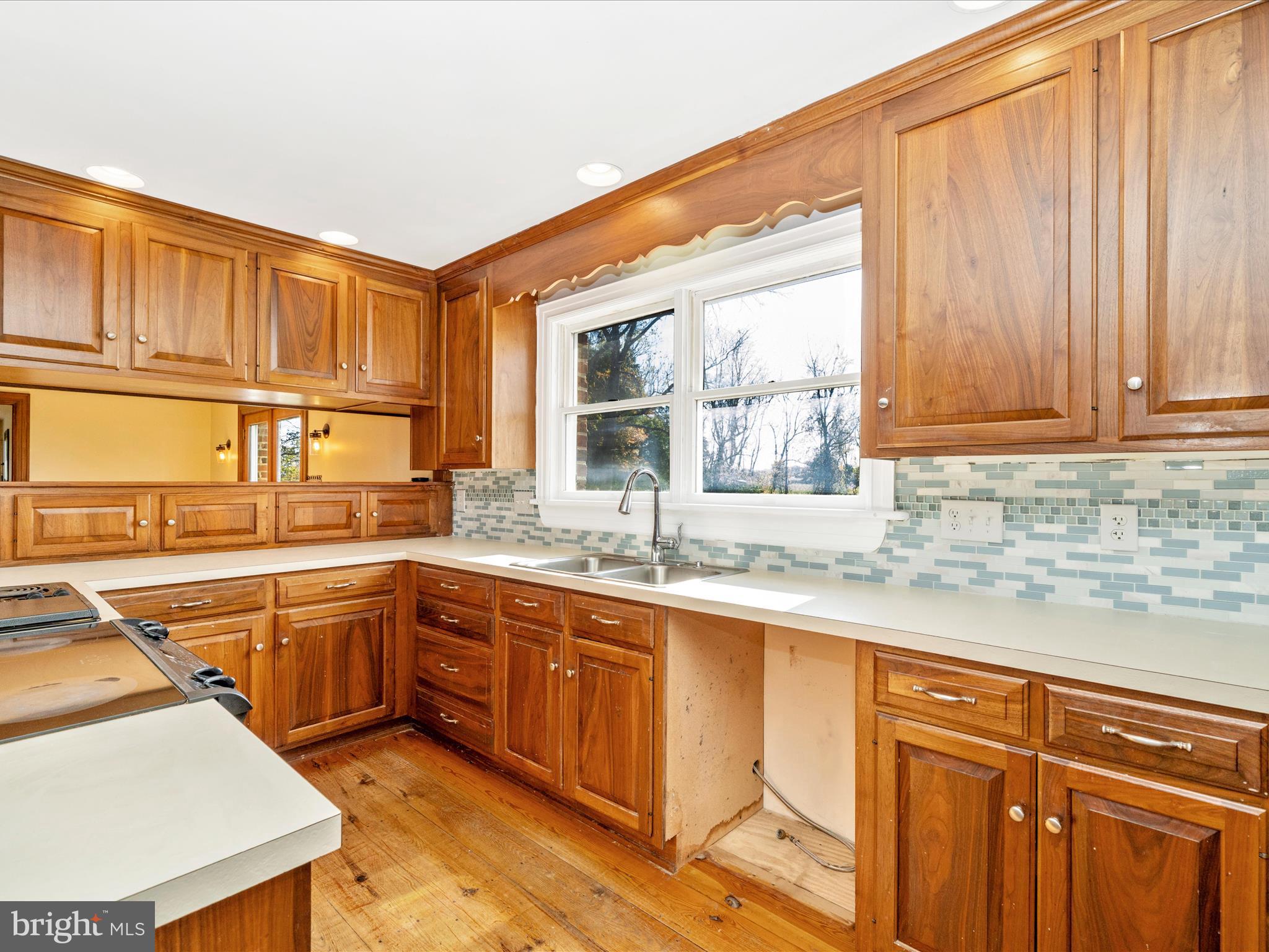 14924 Clear Spring Road Williamsport, MD 21795 - Photo 14 of 76 a kitchen with stainless steel appliances granite countertop a sink and cabinets