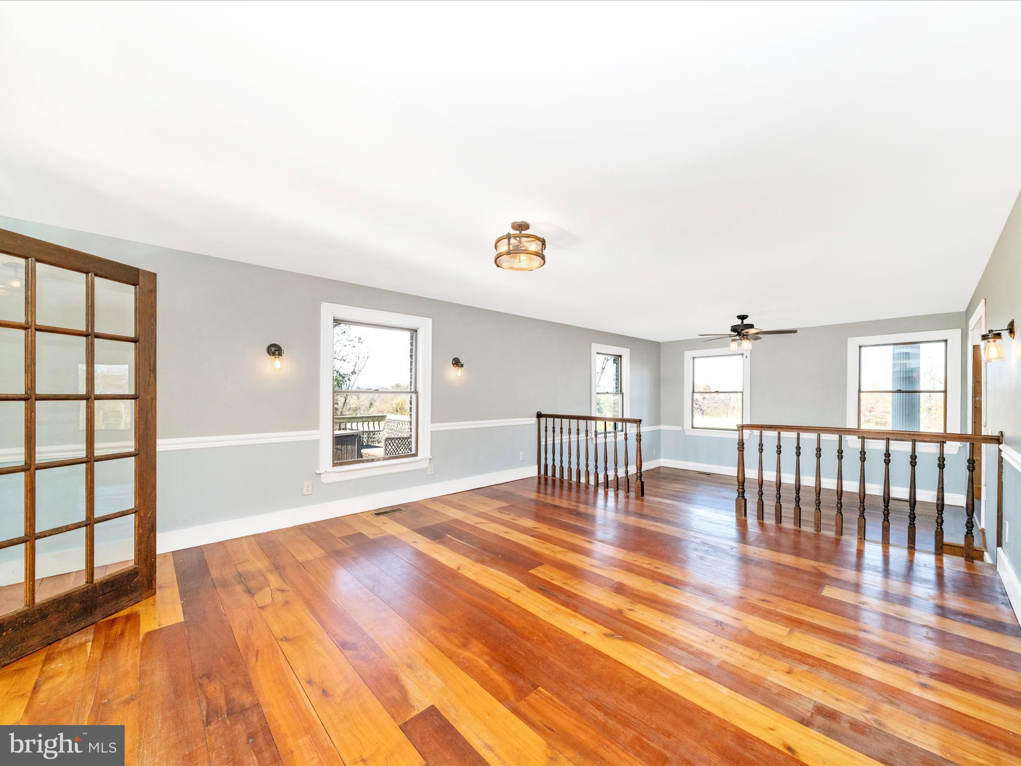14924 Clear Spring Road Williamsport, MD 21795 - Photo 18 of 76 a view of an empty room with wooden floor and a window