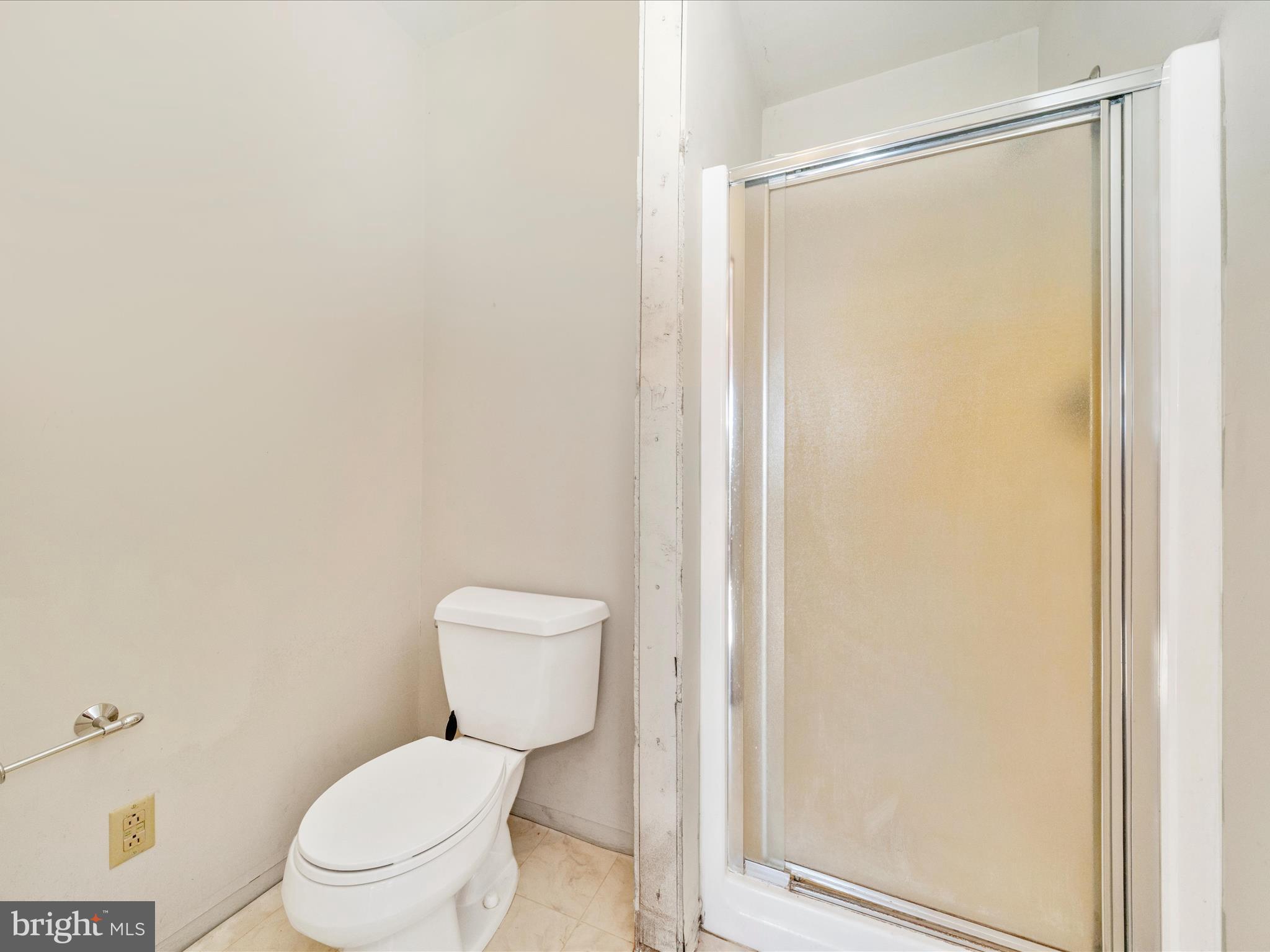 14924 Clear Spring Road Williamsport, MD 21795 - Photo 34 of 76 a white toilet sitting next to a shower