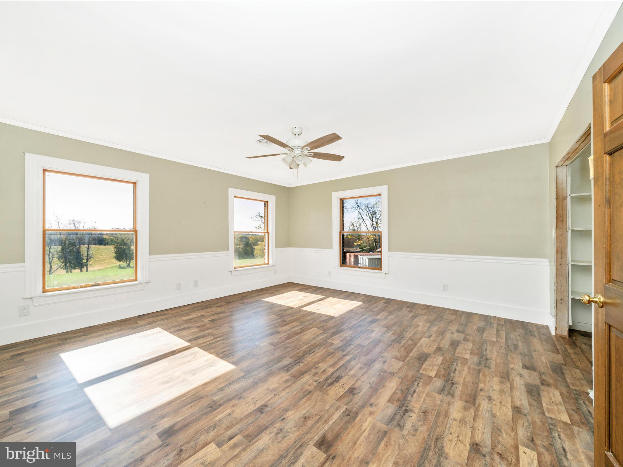 14924 Clear Spring Road Williamsport, MD 21795 - Photo 35 of 76 a view of an empty room with wooden floor and a window
