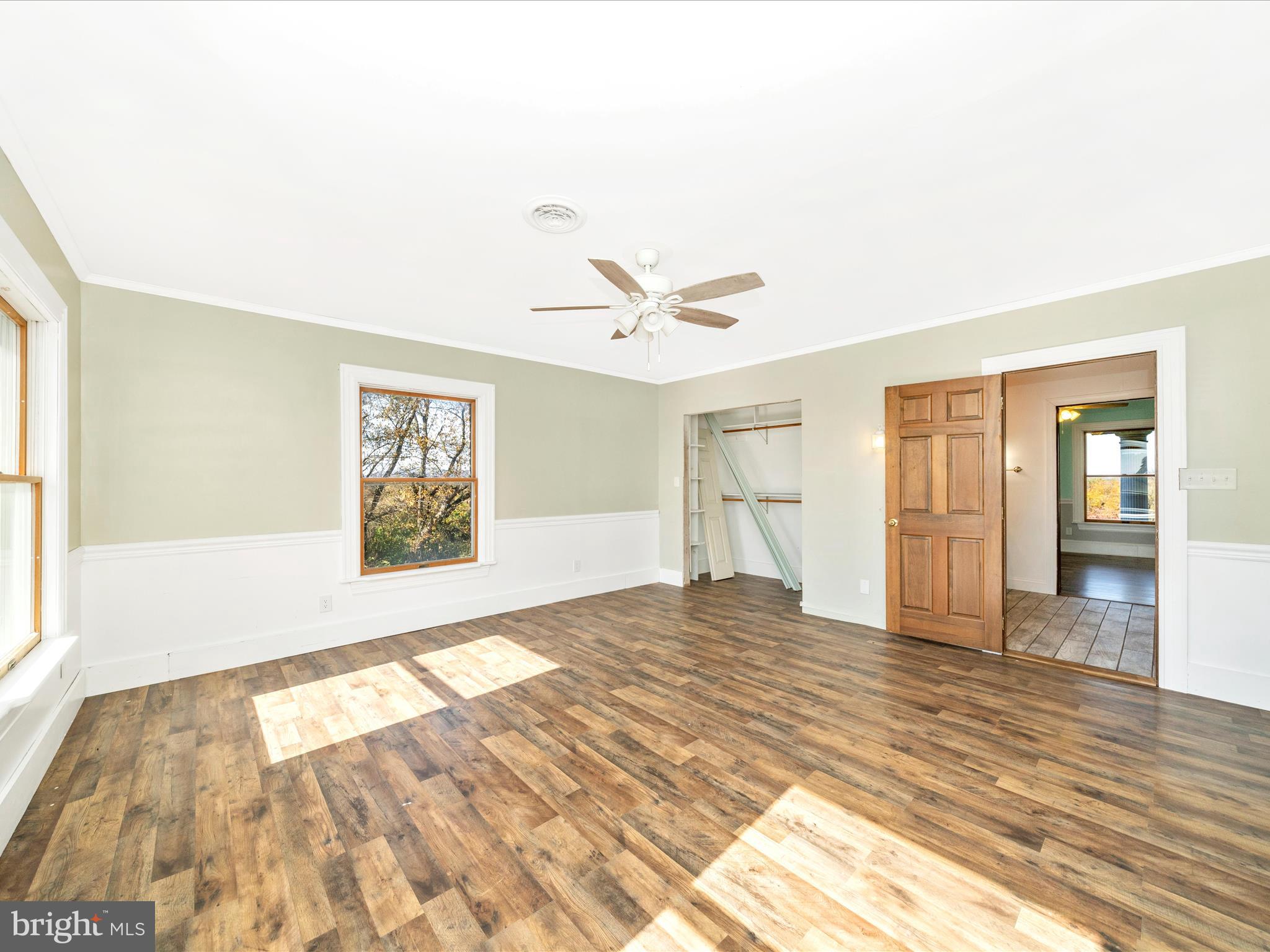 14924 Clear Spring Road Williamsport, MD 21795 - Photo 36 of 76 a view of empty room with wooden floor and fan