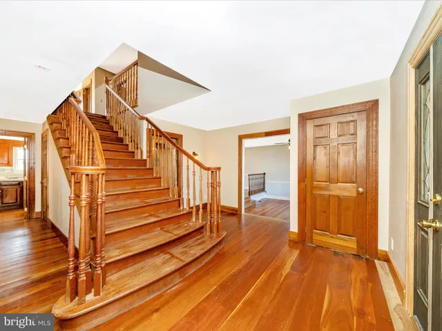 a living room with stainless steel appliances granite countertop furniture and a window
