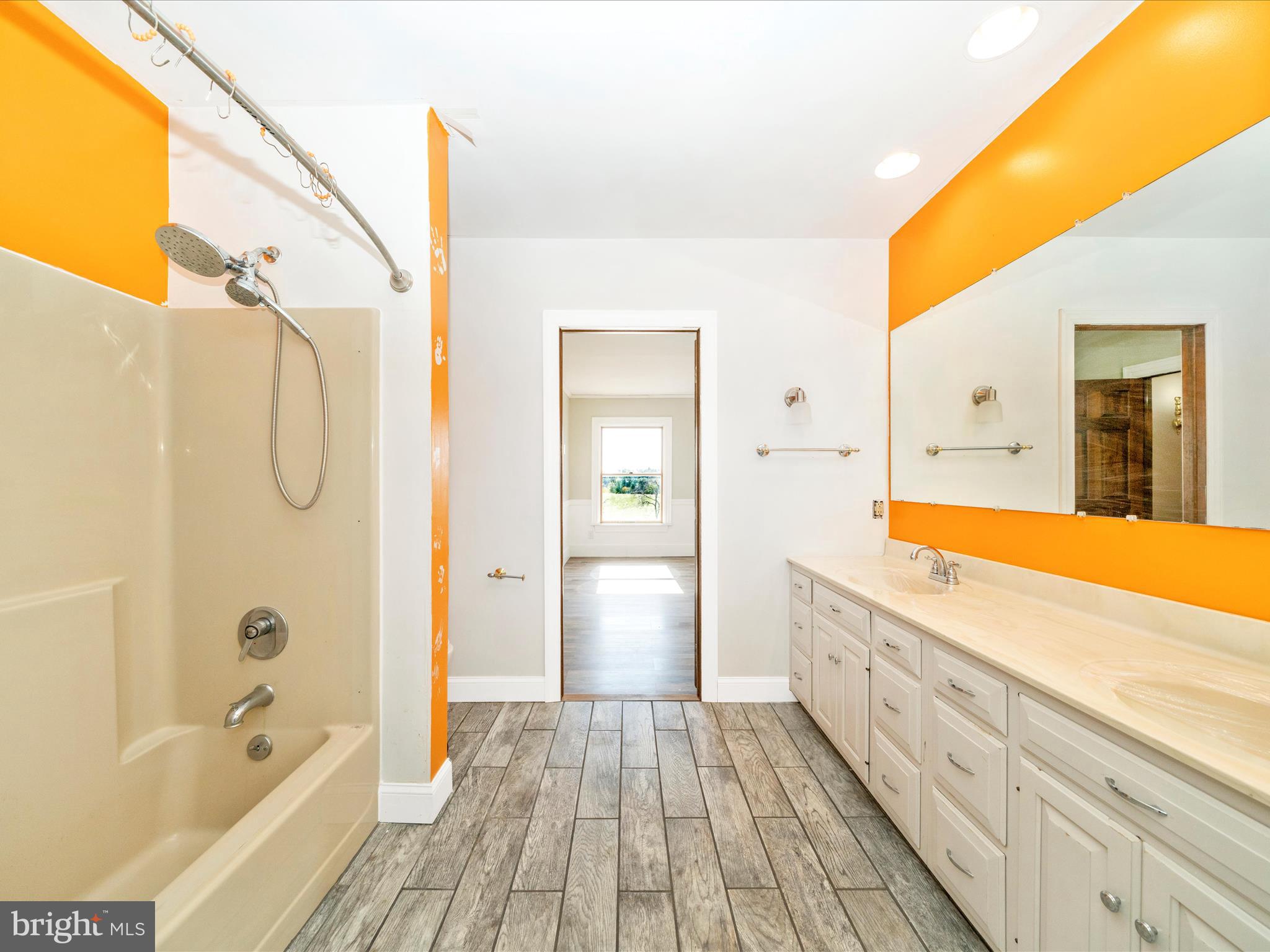 14924 Clear Spring Road Williamsport, MD 21795 - Photo 41 of 76 a spacious bathroom with a tub sink and mirror