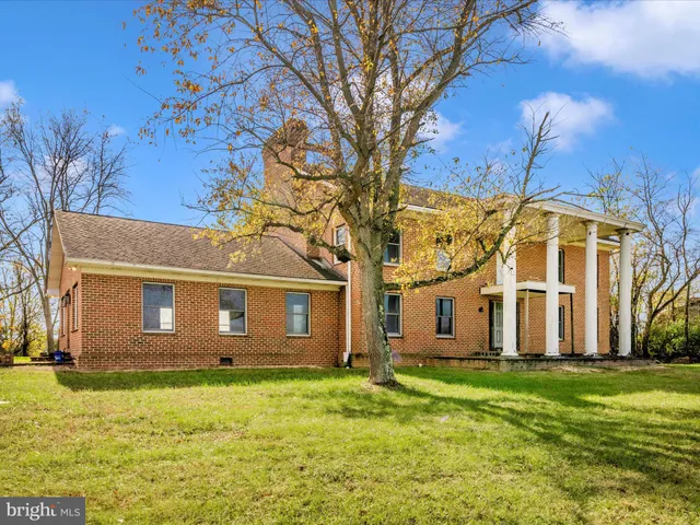 a view of a swimming pool with a yard and mountain view