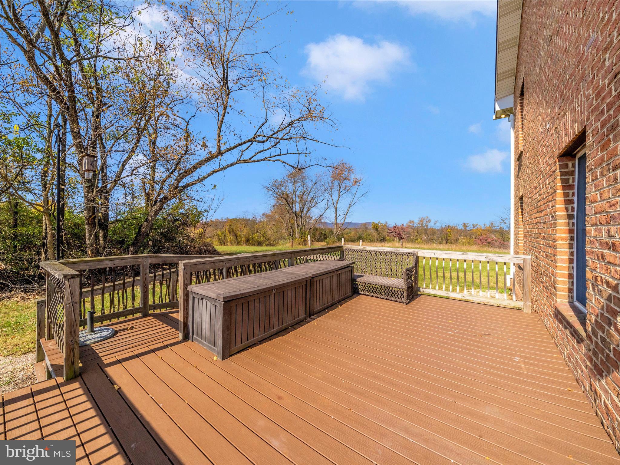 14924 Clear Spring Road Williamsport, MD 21795 - Photo 54 of 76 a view of a balcony with wooden floor and outdoor seating