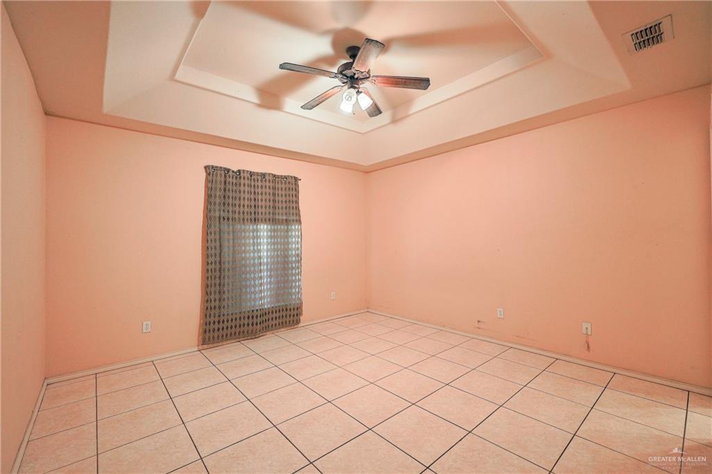 713 West 24th Place Mission, TX 78574 - Photo 16 of 36 a view of an empty room with a window
