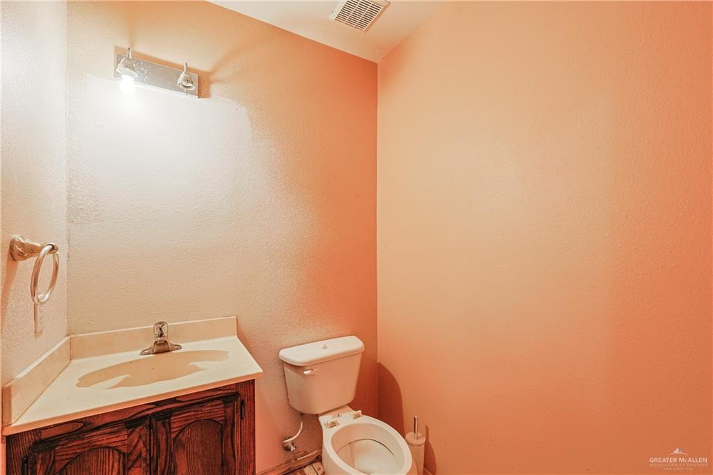 713 West 24th Place Mission, TX 78574 - Photo 21 of 36 a bathroom with a sink and a toilet