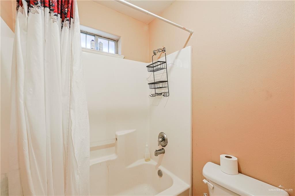 713 West 24th Place Mission, TX 78574 - Photo 25 of 36 a bathroom with a bathtub and shower