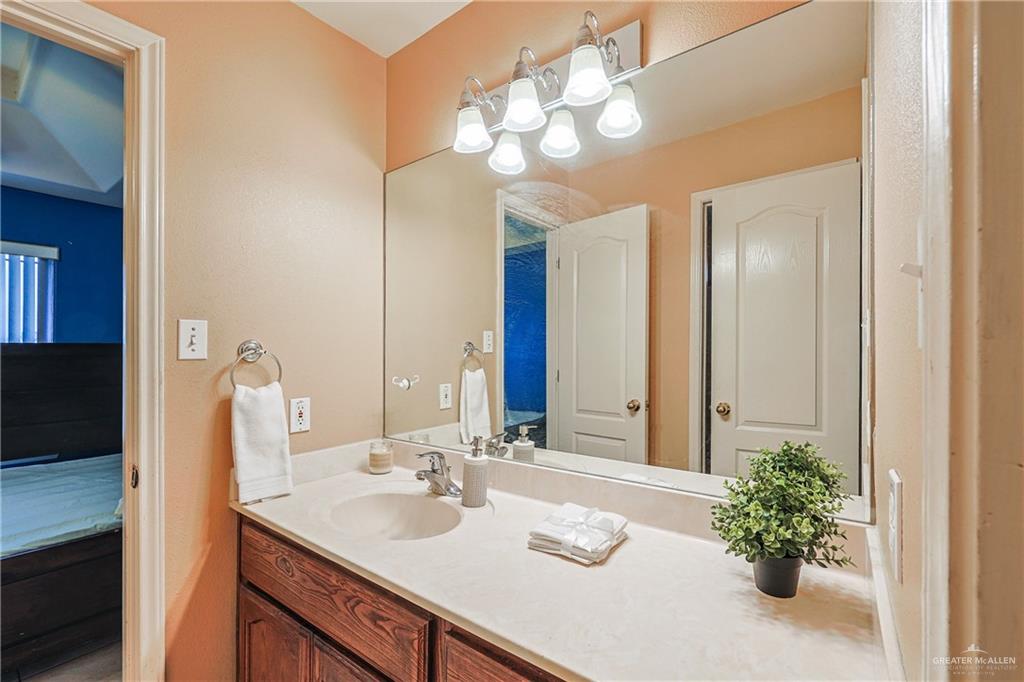 713 West 24th Place Mission, TX 78574 - Photo 26 of 36 a bathroom with a sink double vanity and a mirror