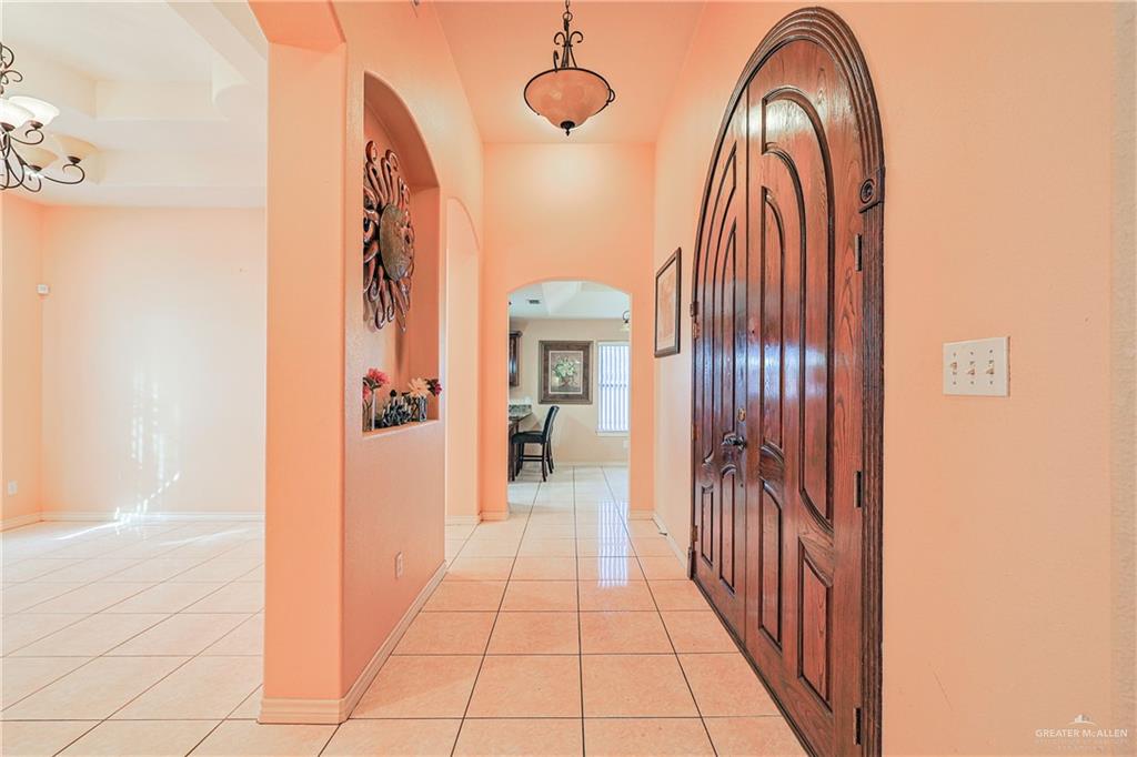 713 West 24th Place Mission, TX 78574 - Photo 5 of 36 a view of a hallway with wooden floor and cabinet