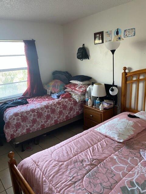 3253 Kirk Road, Unit 8 Lake Worth, FL 33461 - Photo 8 of 8 a bedroom with bed and a window