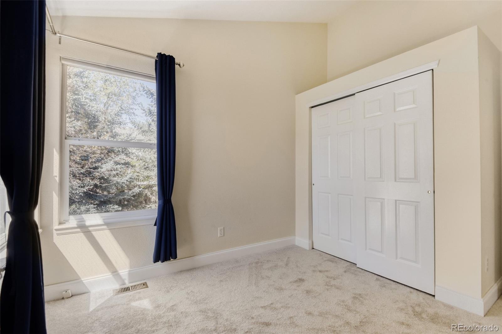 10047 Andrush Court Lone Tree, CO 80124 - Photo 29 of 37 a view of a room with a wooden floor and windows
