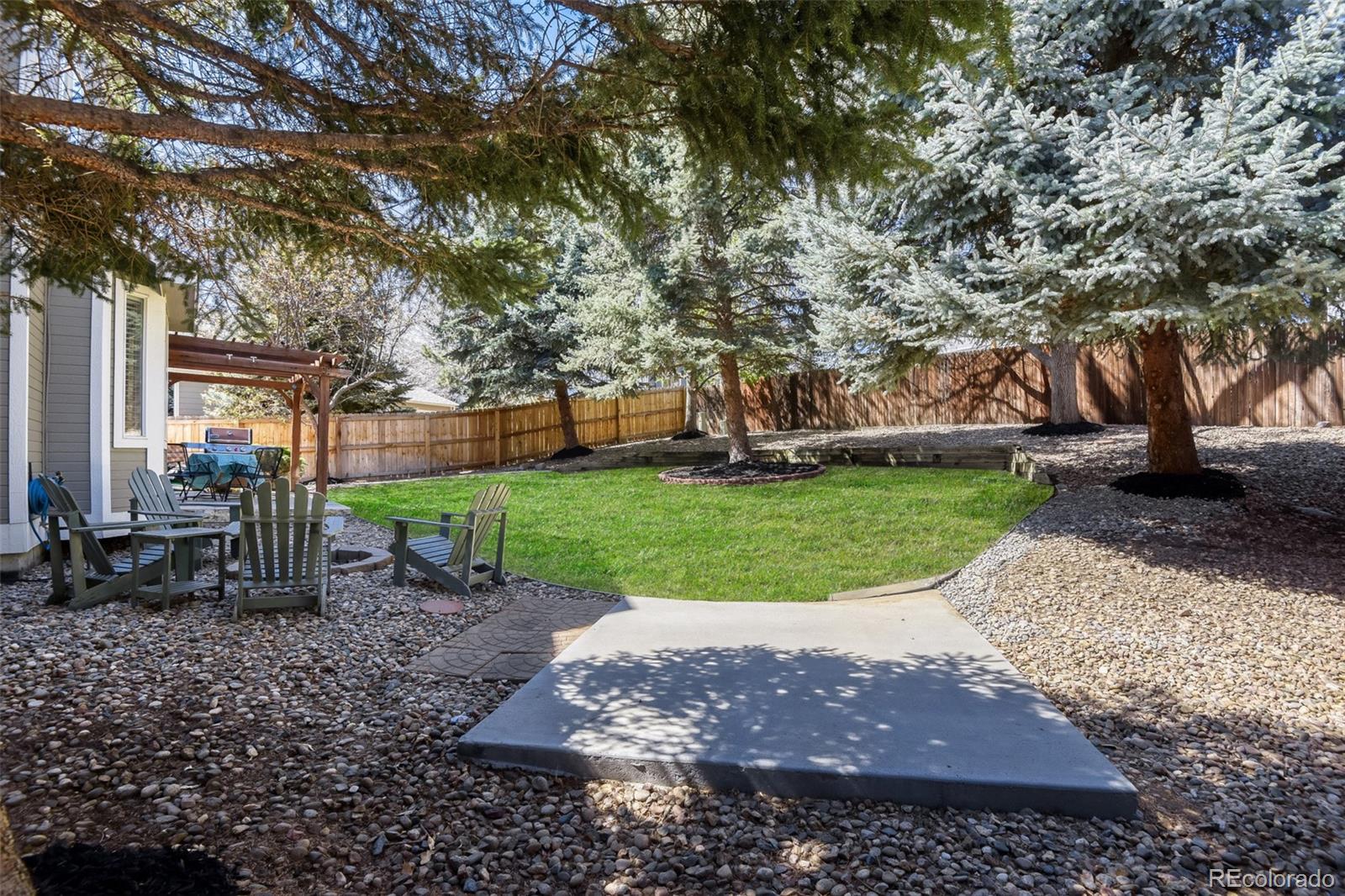 10047 Andrush Court Lone Tree, CO 80124 - Photo 33 of 37 a view of a backyard with a garden
