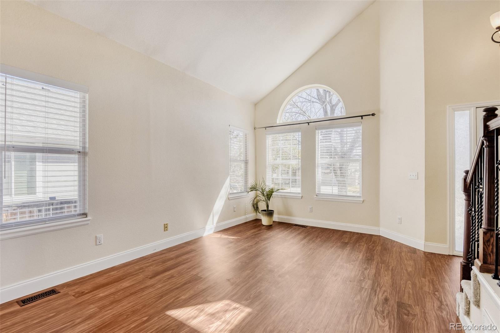 10047 Andrush Court Lone Tree, CO 80124 - Photo 7 of 37 an empty room with wooden floor and a window