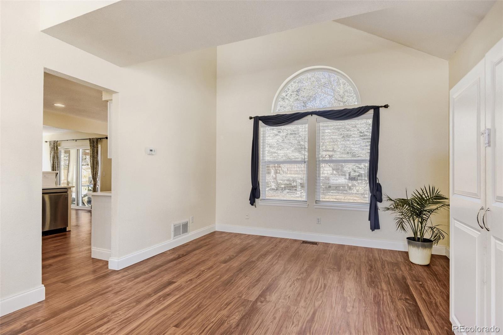 10047 Andrush Court Lone Tree, CO 80124 - Photo 10 of 37 wooden floor in an empty room with a window