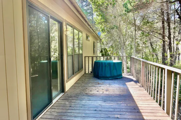 a view of balcony with wooden floor