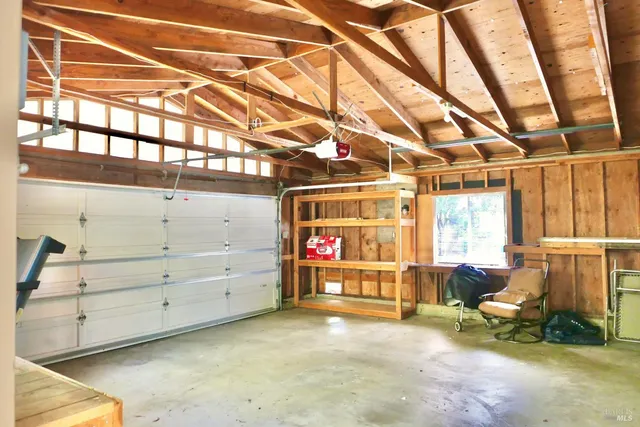 a view of a room with furniture and window