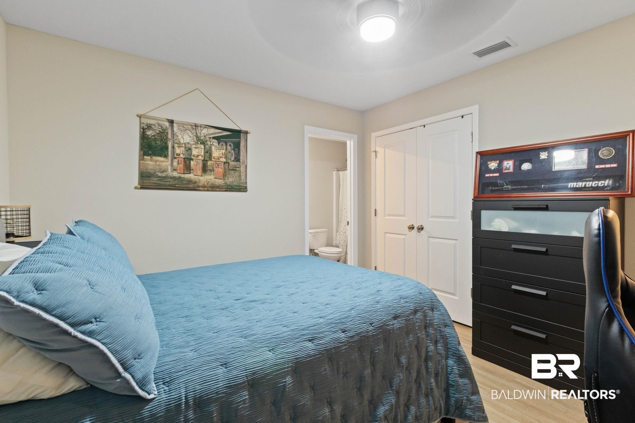 1203 Hayward Loop Foley, AL 36535 - Photo 28 of 41 Bedroom with light wood-type flooring, a closet, and a ceiling fan