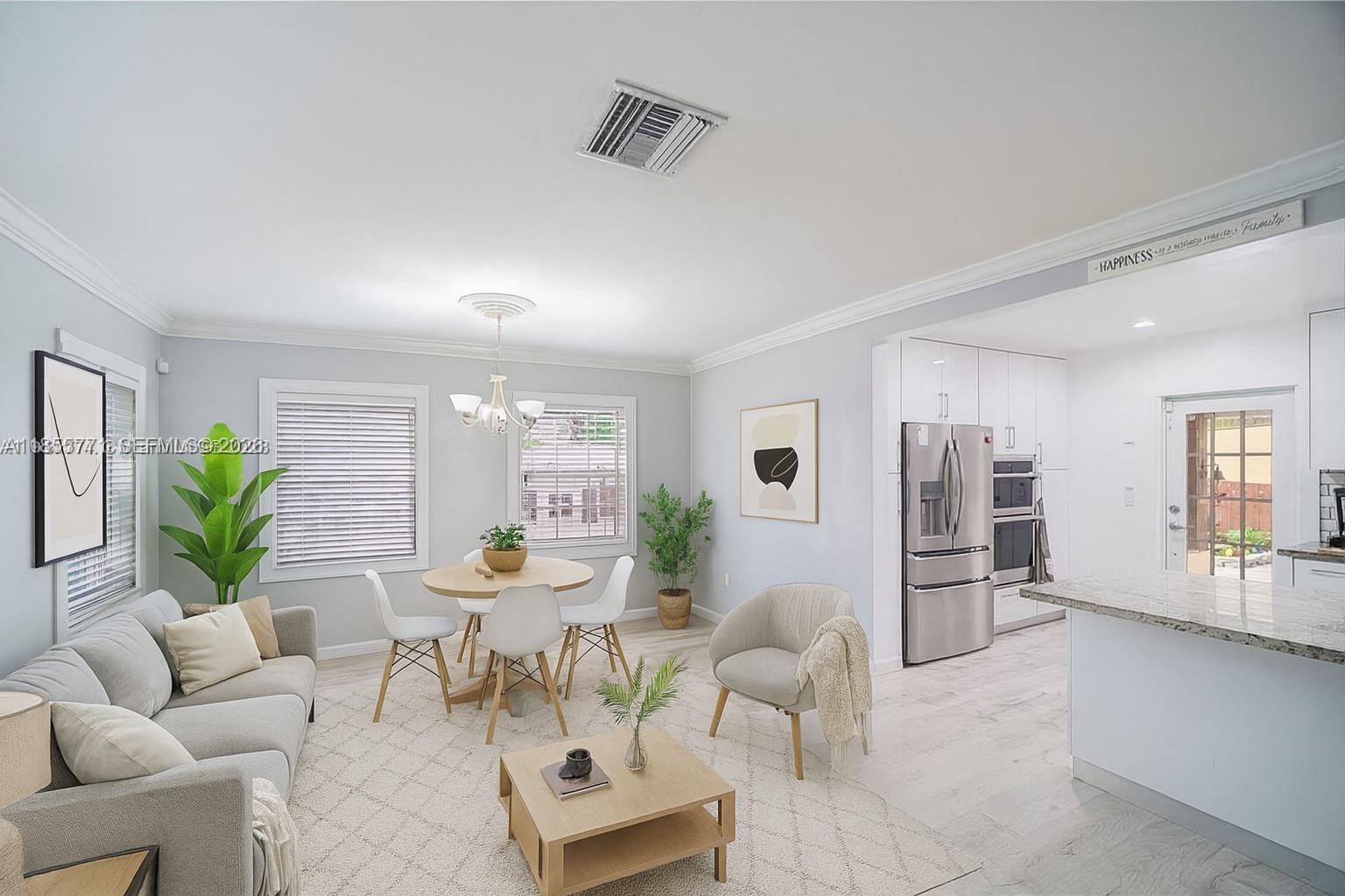 This photo has been virtually staged, offering a different layot for the living and dining room combination