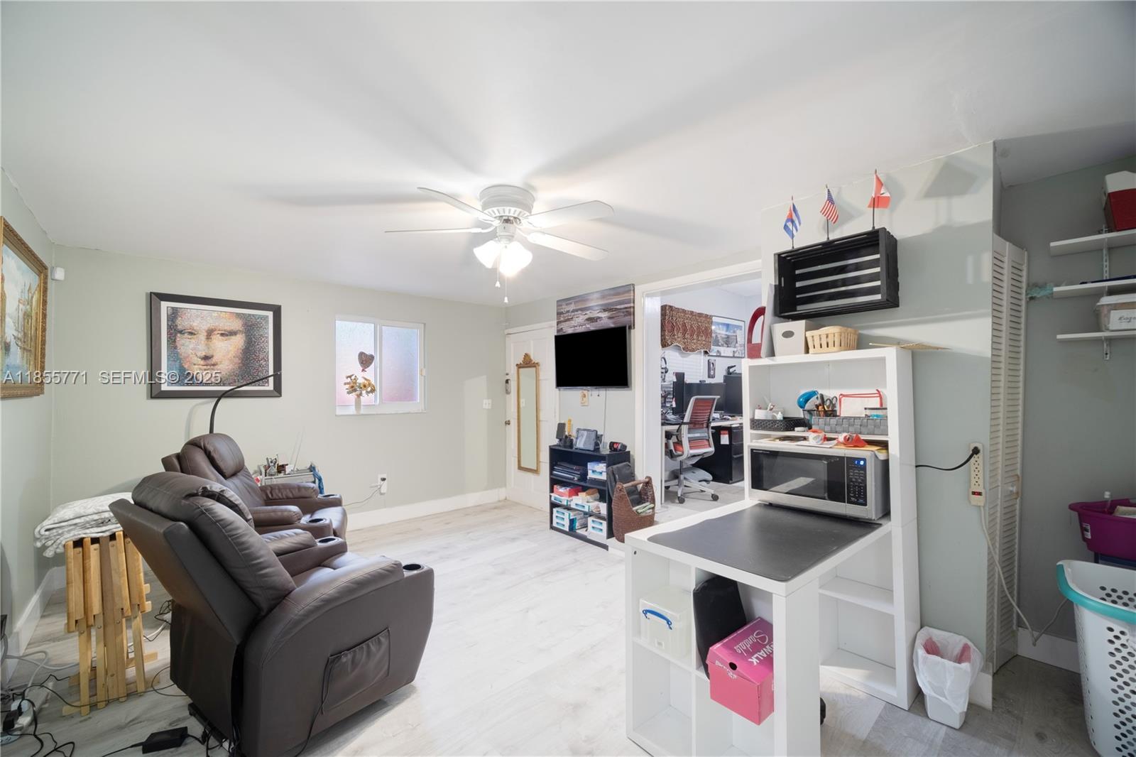 3715 Southwest 29th Street Miami, FL 33134 - Photo 16 of 22 a living room with furniture and a flat screen tv