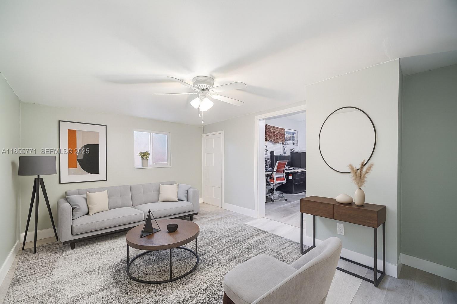 3715 Southwest 29th Street Miami, FL 33134 - Photo 17 of 22 a living room with furniture a table and a mirror