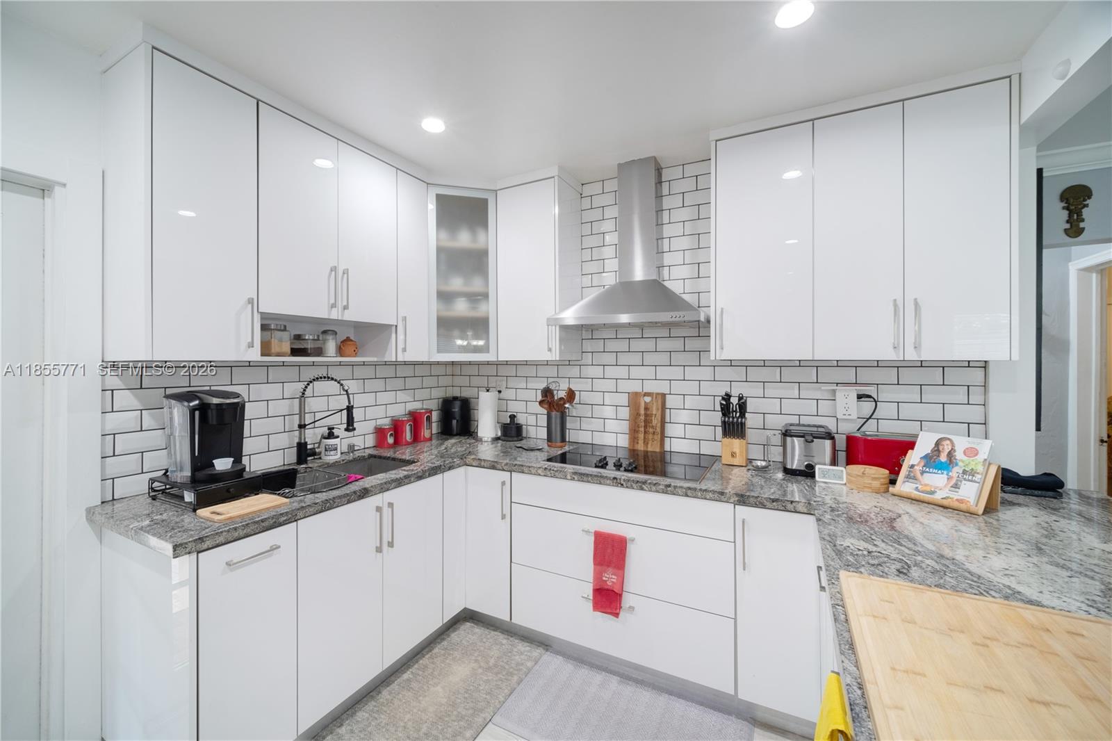 3715 Southwest 29th Street Miami, FL 33134 - Photo 2 of 17 Beautifully renovated Photo of renovated kitchen, with white cabinets, Samsung applicances and massive counter space