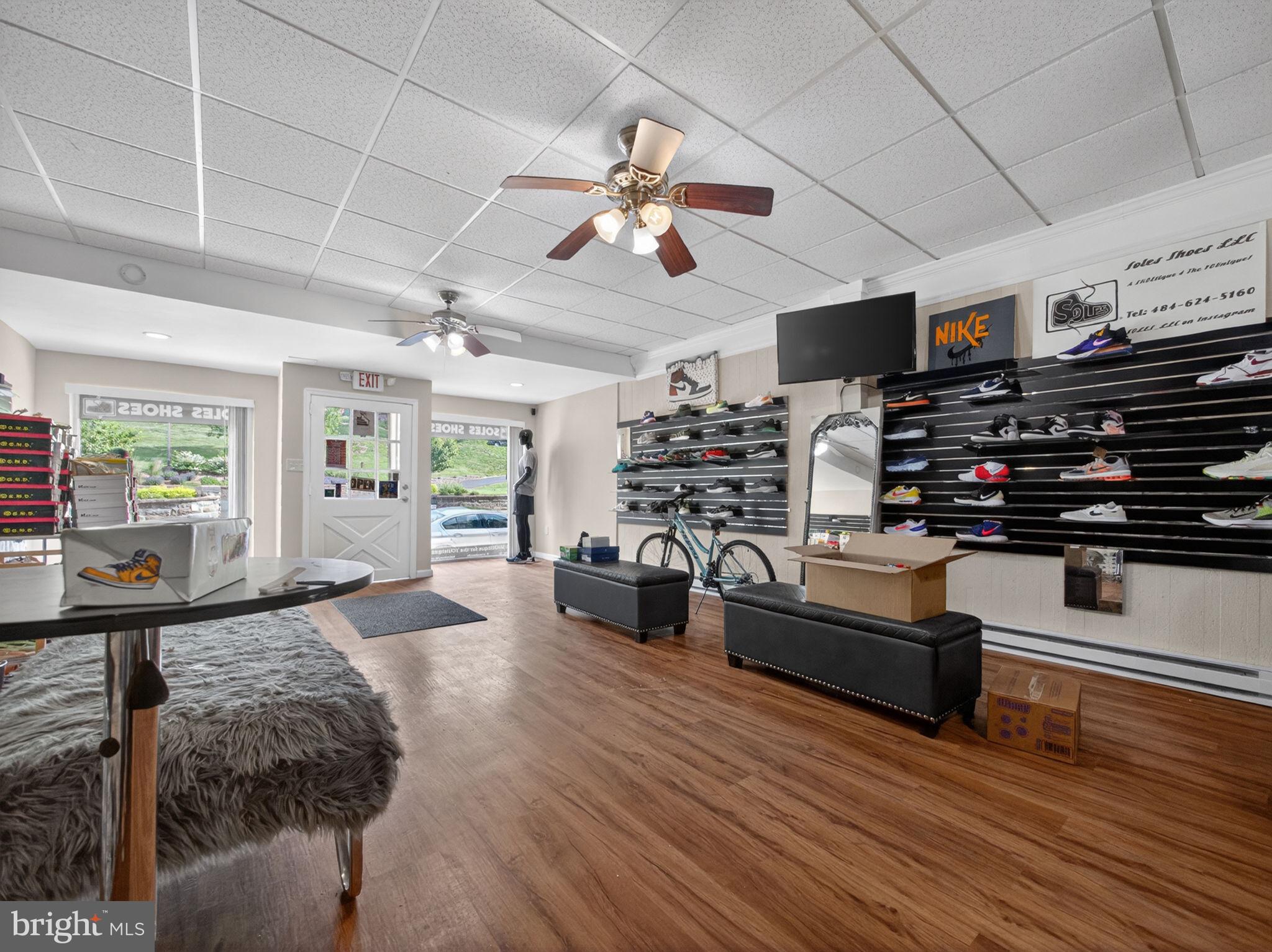 866 East High Street Pottstown, PA 19464 - Photo 12 of 45 Sleek sneaker shop with vibrant displays.
