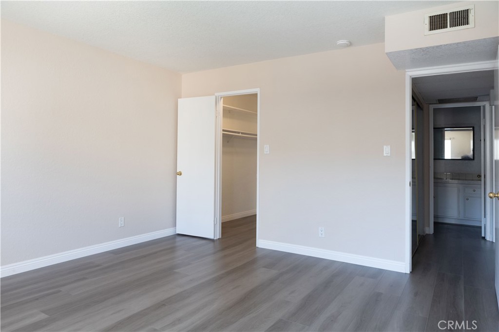 2386 East Del Mar Boulevard, Unit 203 Pasadena, CA 91107 - Photo 12 of 28 a view of an empty room with wooden floor