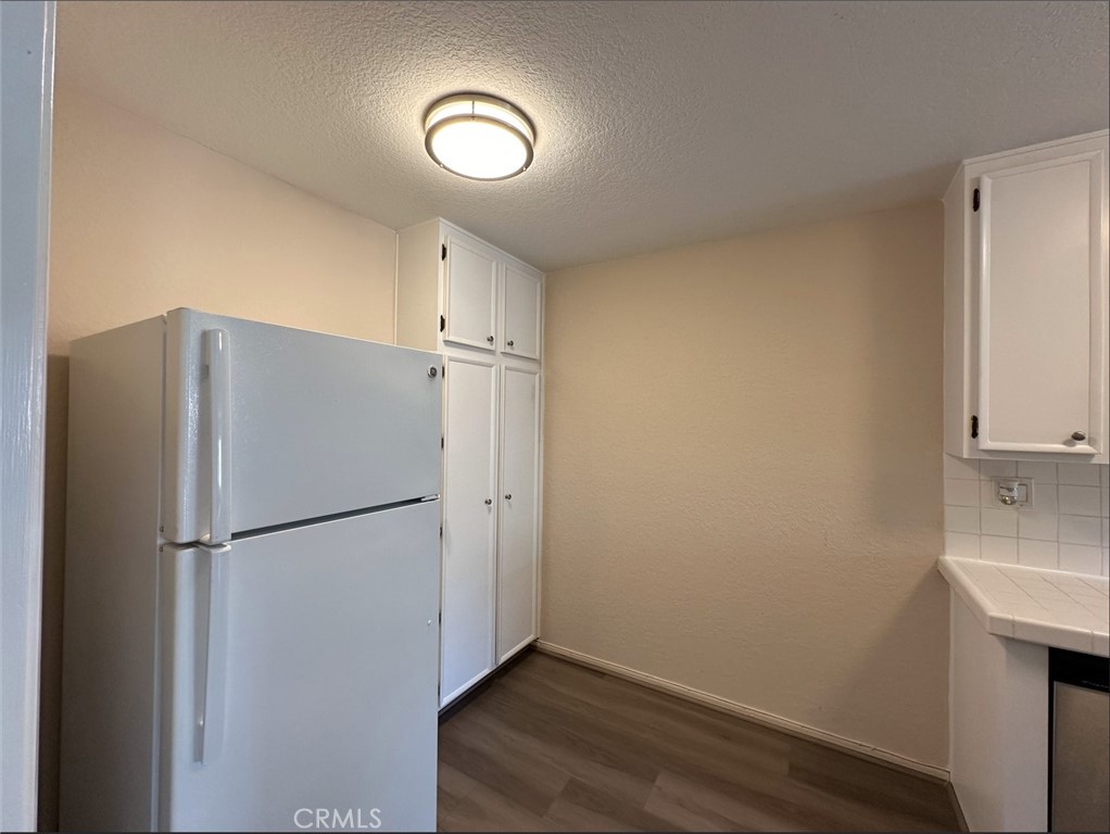 2386 East Del Mar Boulevard, Unit 203 Pasadena, CA 91107 - Photo 26 of 28 a view of a kitchen with a refrigerator a sink and dishwasher