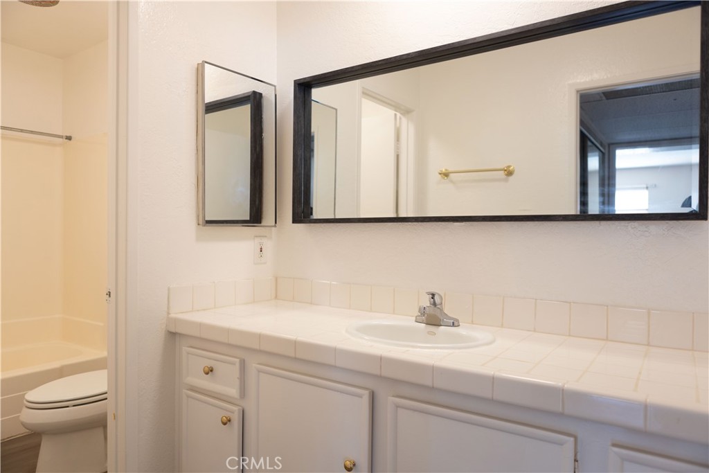 2386 East Del Mar Boulevard, Unit 203 Pasadena, CA 91107 - Photo 8 of 28 a bathroom with a sink and a toilet