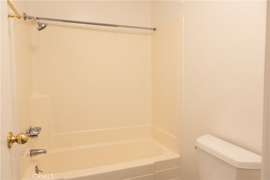 2386 East Del Mar Boulevard, Unit 203 Pasadena, CA 91107 - Photo 9 of 28 a bathroom with a shower and a toilet
