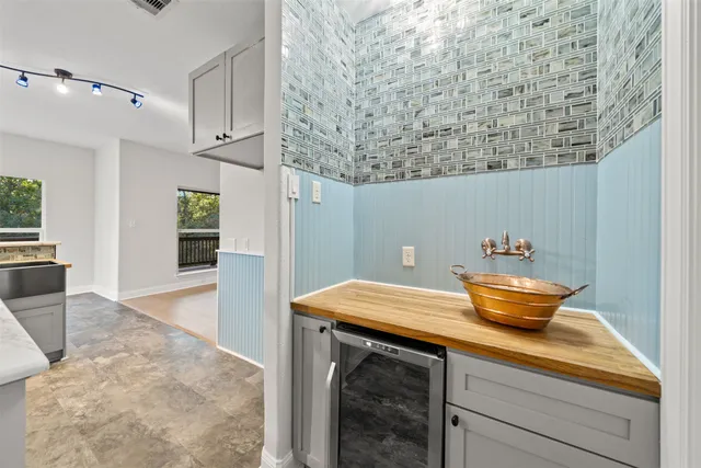 a dining room with a table and chairs