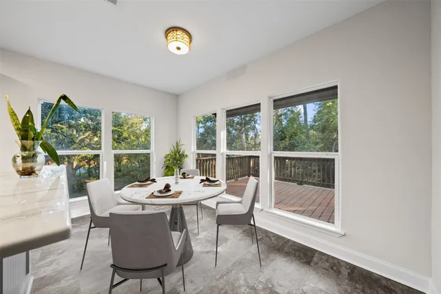 a view of a dining room with furniture window and outside view