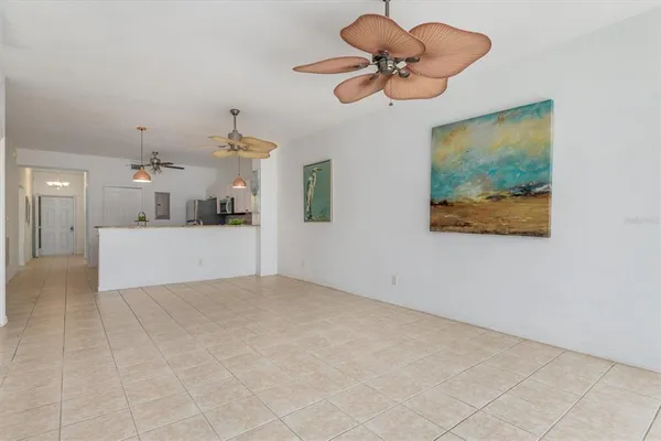 a view of a kitchen with a ceiling fan and window