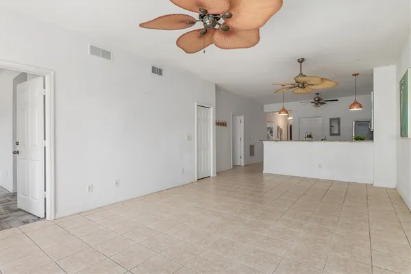 a view interior of a house and a chandelier fan