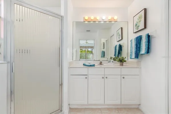 a bathroom with a toilet sink and shower