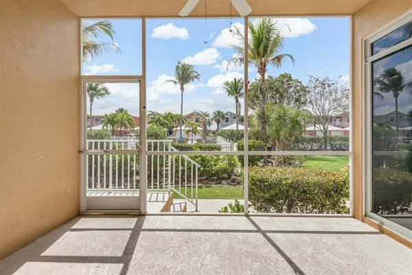 a view of a glass door and a yard