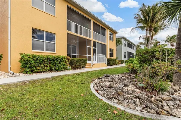 a view of a house with a yard and garage