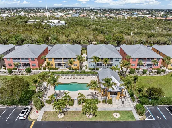 an aerial view of residential houses with outdoor space