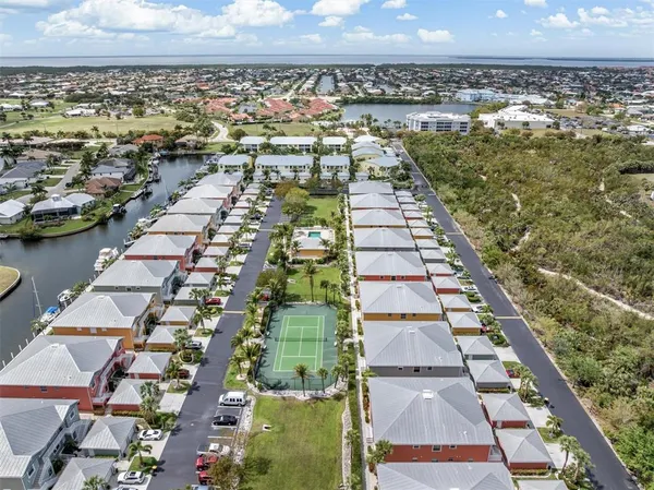 an aerial view of residential houses with outdoor space