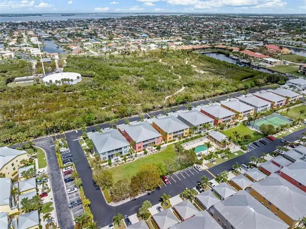 an aerial view of residential houses with outdoor space