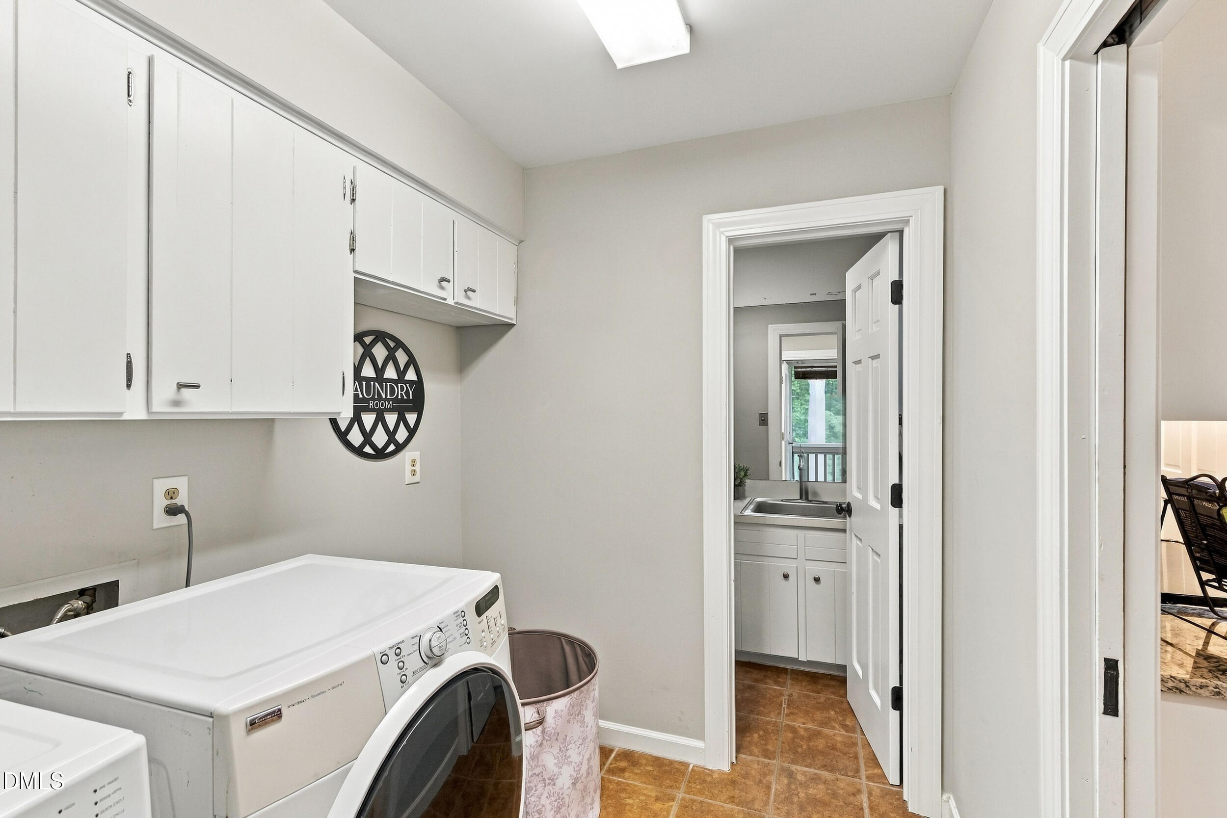 2329 Win Road Garner, NC 27529 - Photo 35 of 90 White upper cabinetry, recessed lighting, and tile flooring