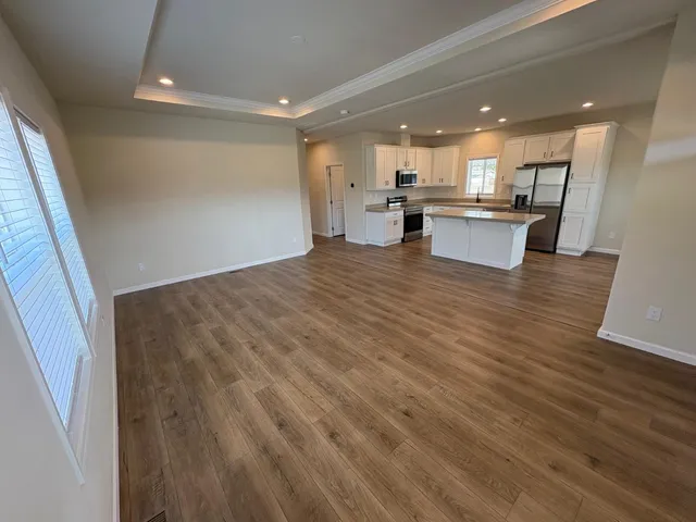 a view of kitchen with wooden floor