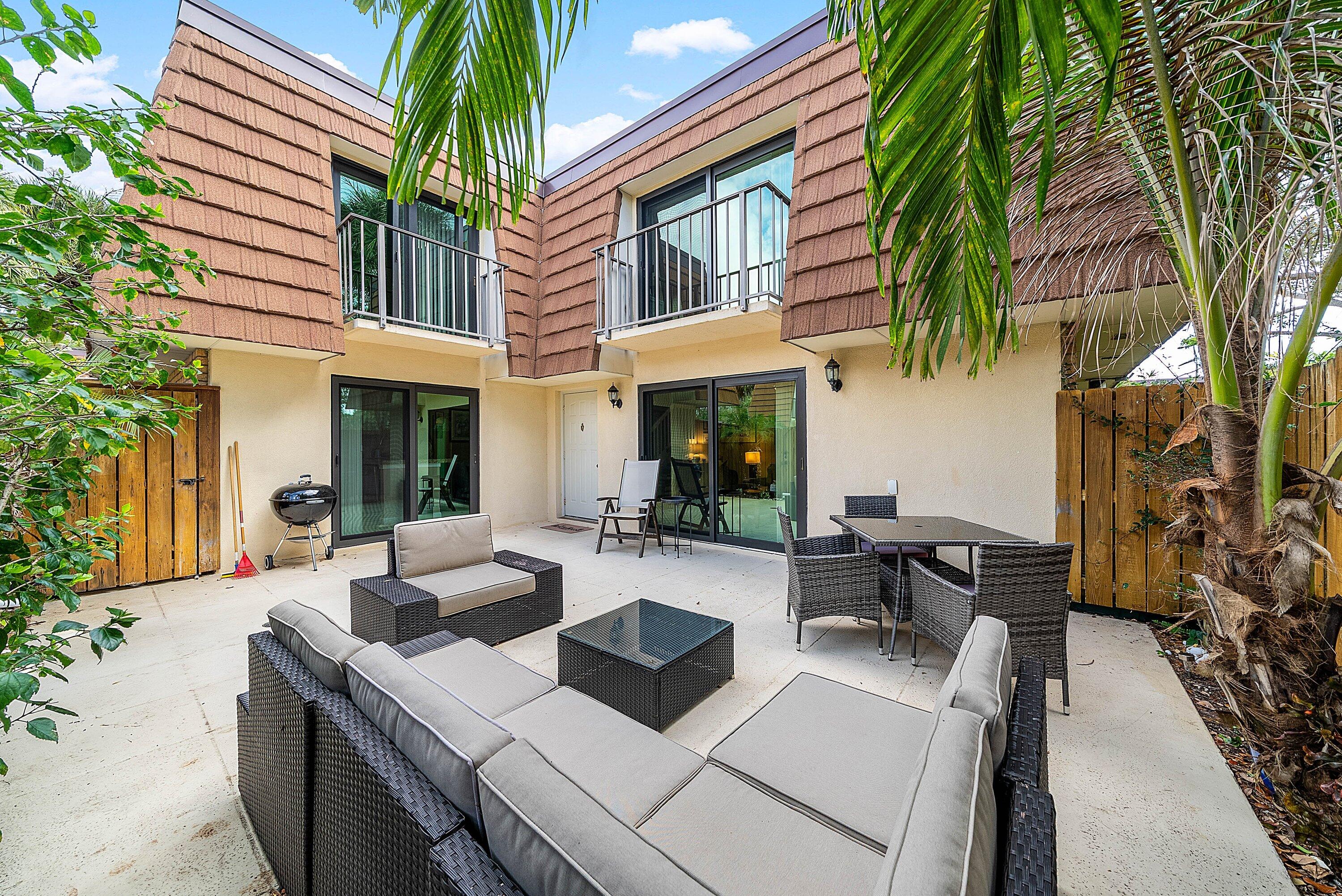 2715 27th Court Jupiter, FL 33477 - Photo 8 of 22 a view of pool with outdoor seating