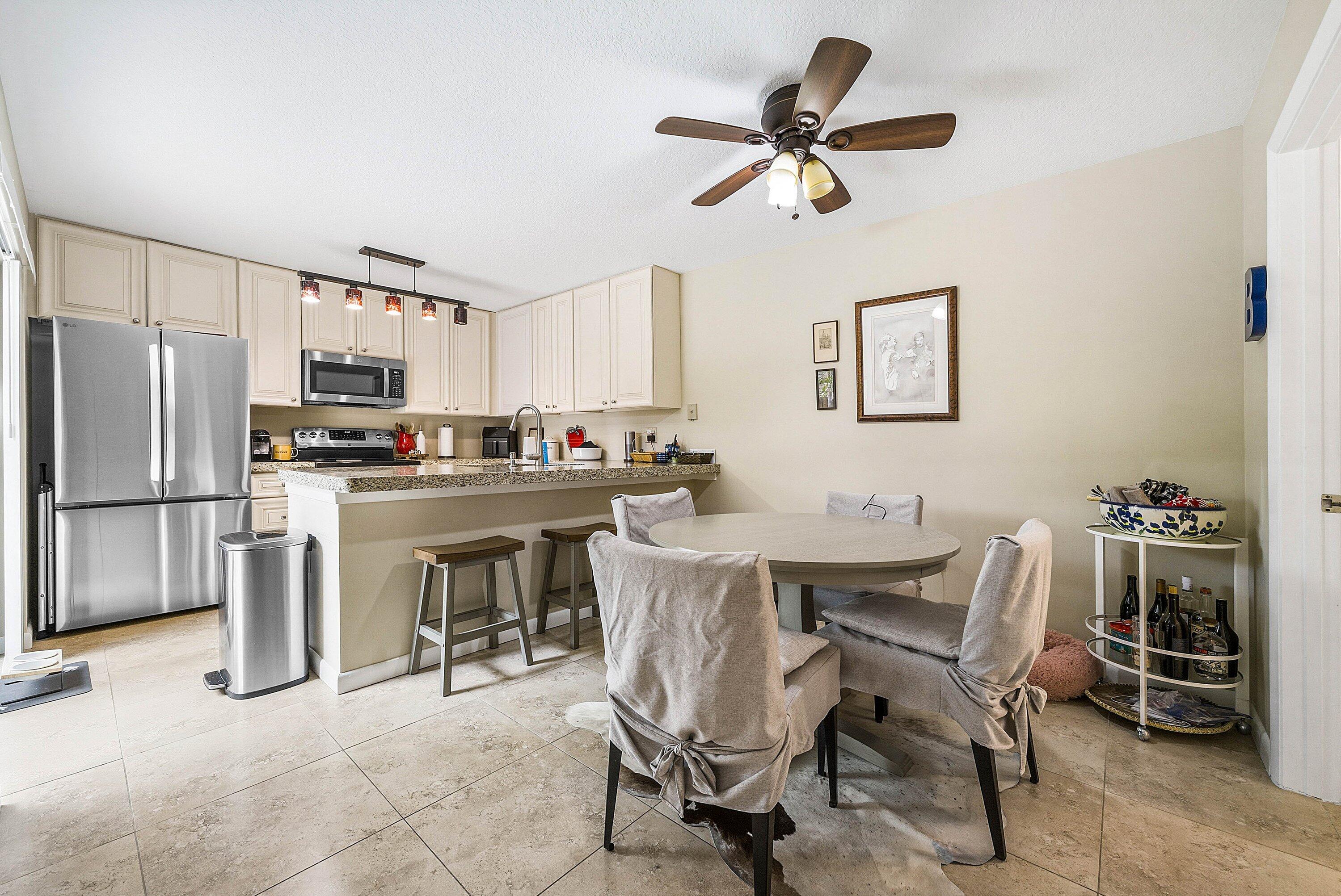 2715 27th Court Jupiter, FL 33477 - Photo 9 of 22 a view of a dining room with furniture