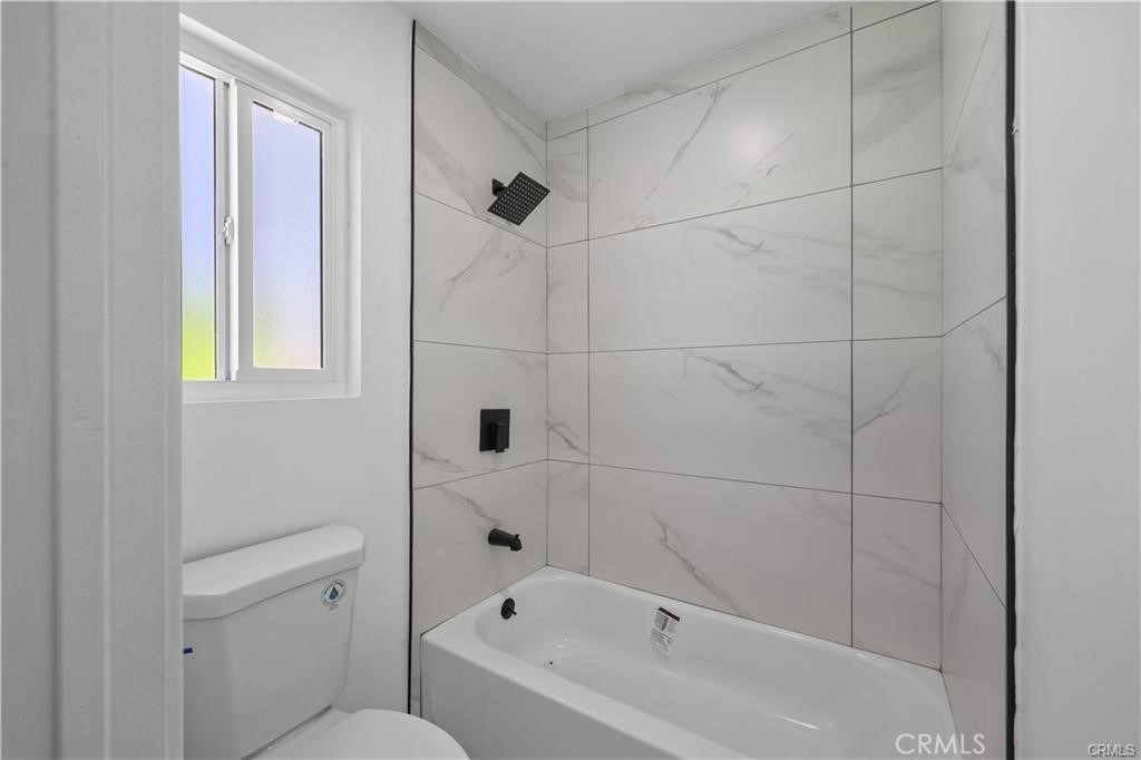 40635 159th Street East Lancaster, CA 93535 - Photo 16 of 25 a bathroom with a bathtub and shower